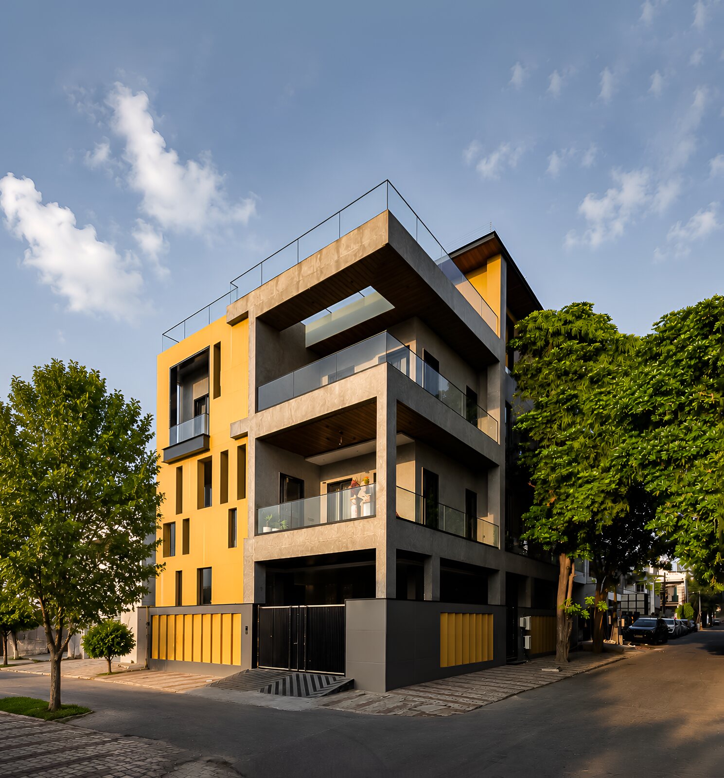 The street front, folding ochre screens over the entrance.