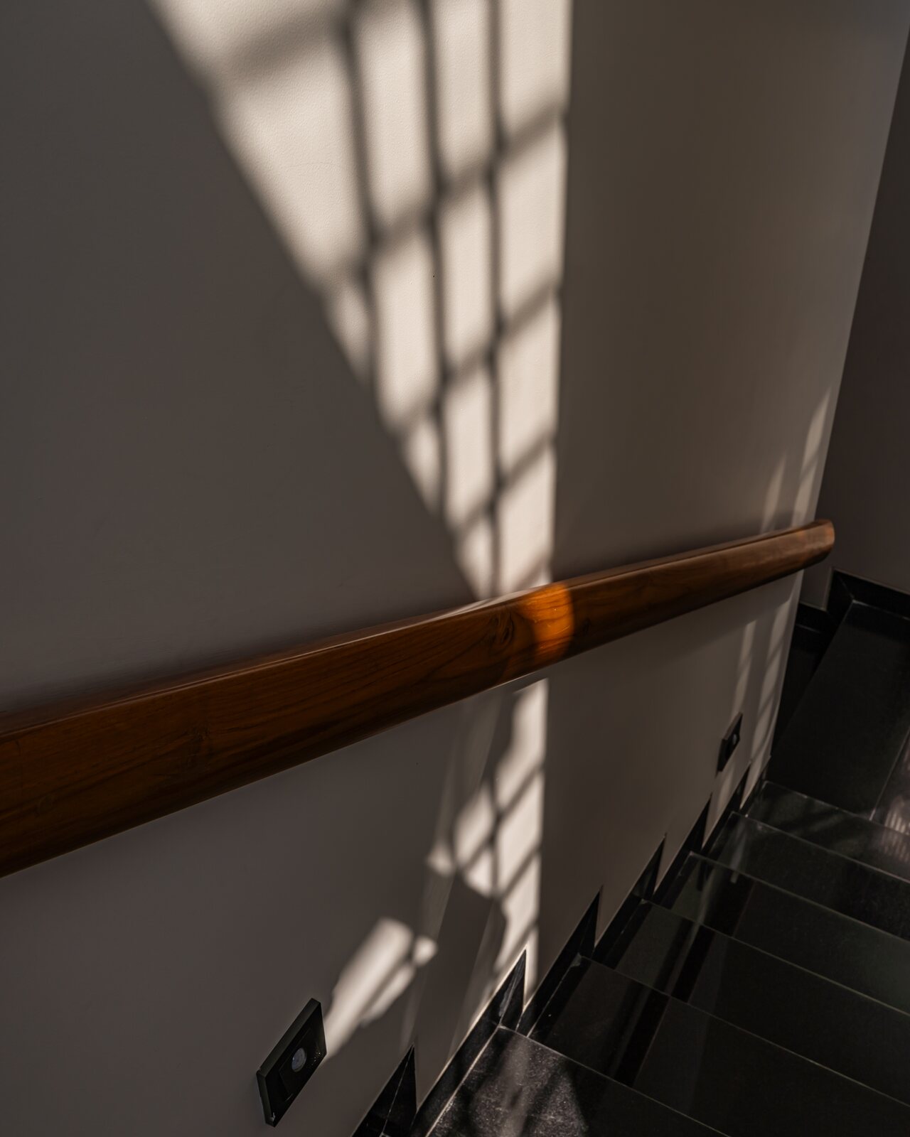 Light rakes down the stair well.