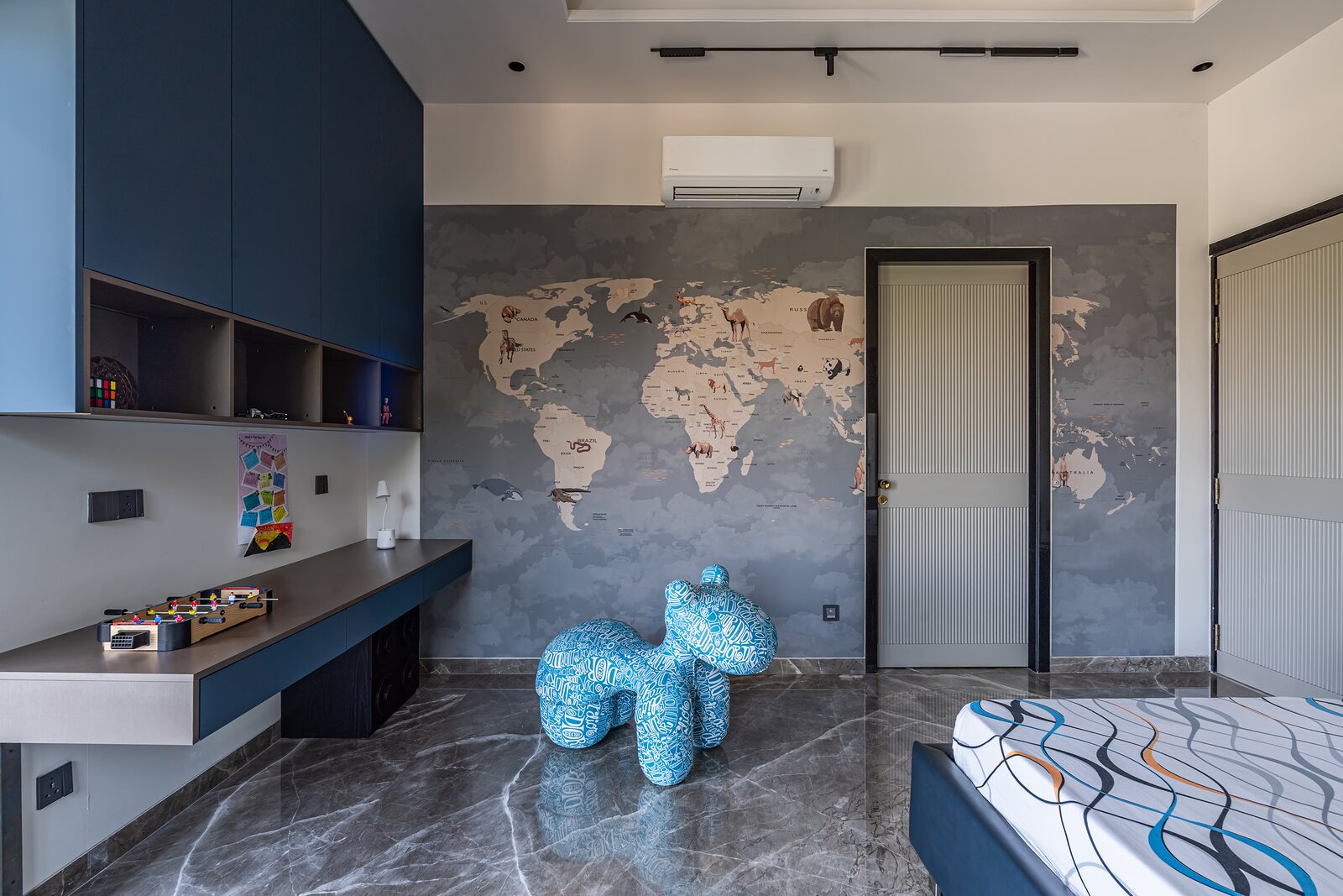 The children's room, a world map set in relief.