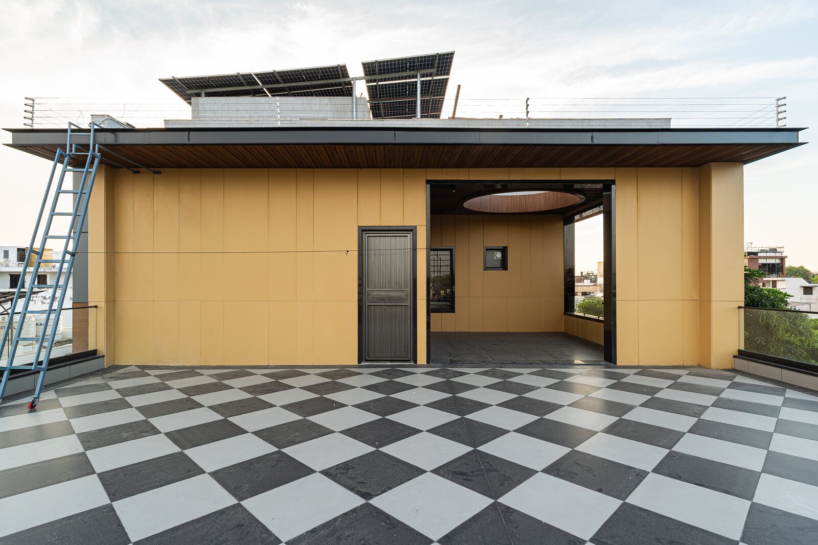 The roof terrace, a checkerboard court under the sky.
