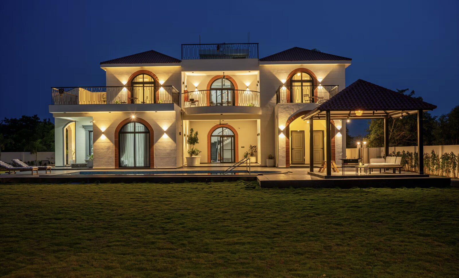 The lit loggia and verandah at dusk.