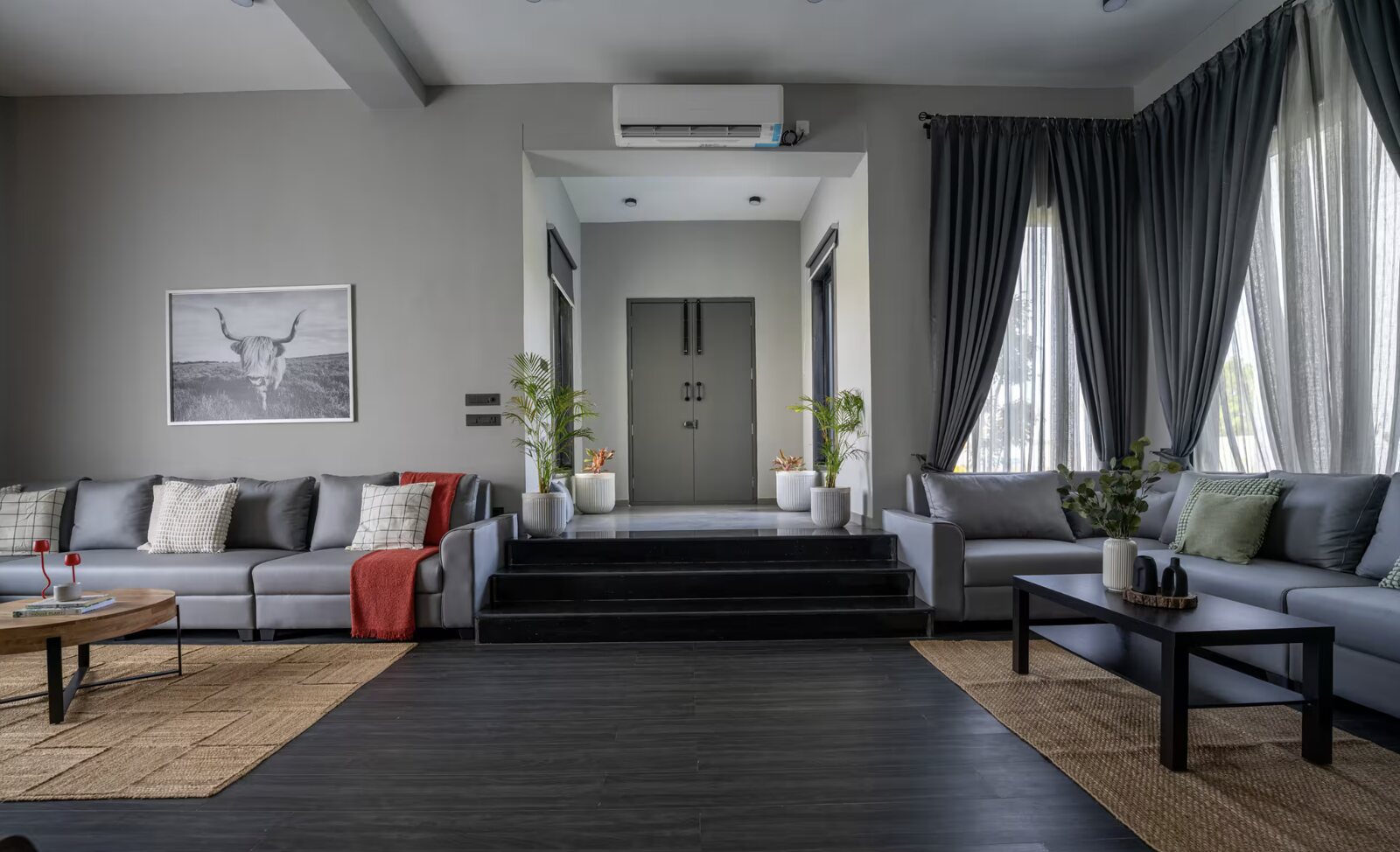 The living room in grey linen and soft light.