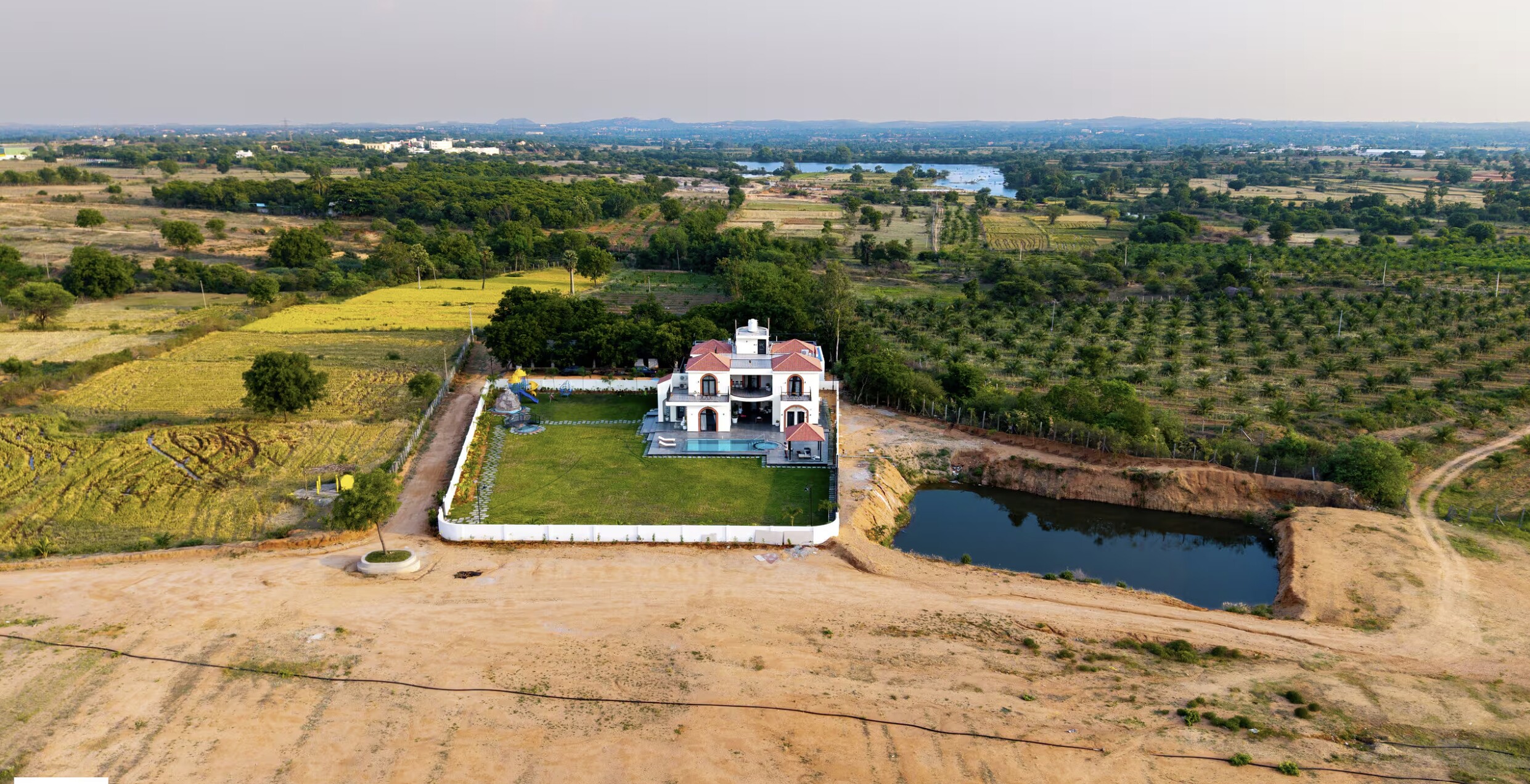 From above, the green plot against the dry land.