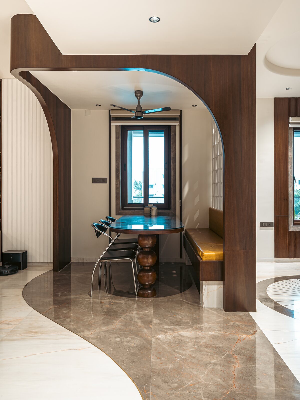 A curved timber screen wraps the bar.