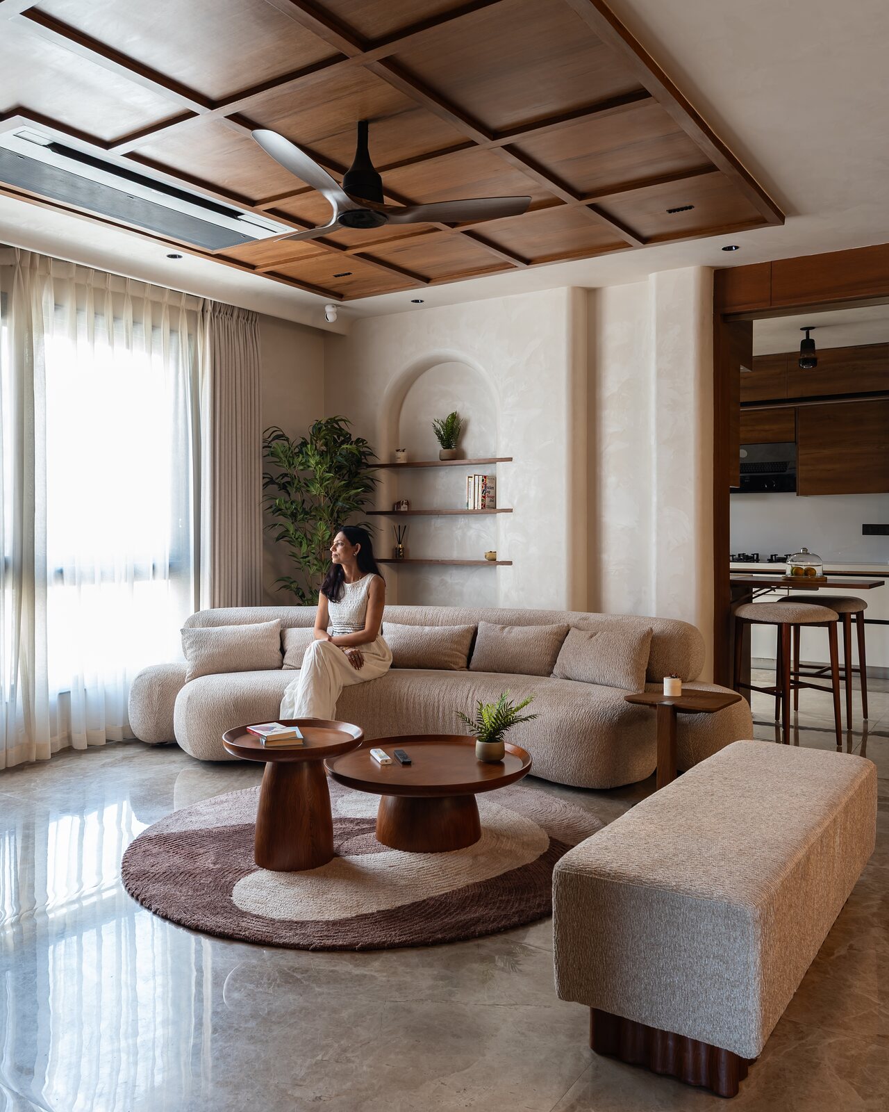 The living opens toward the dining beyond.