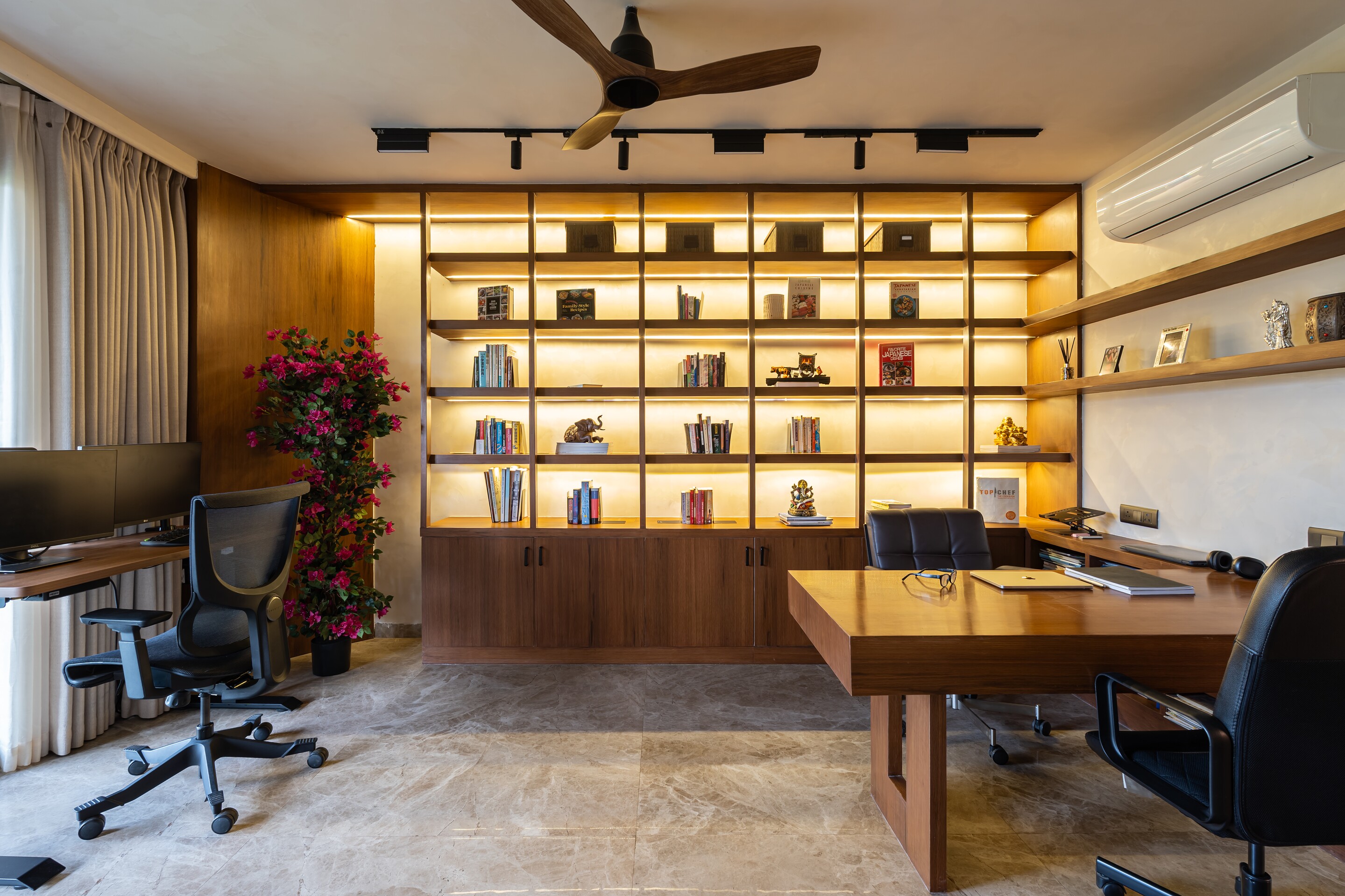 The library. Walnut shelves wrap the study.