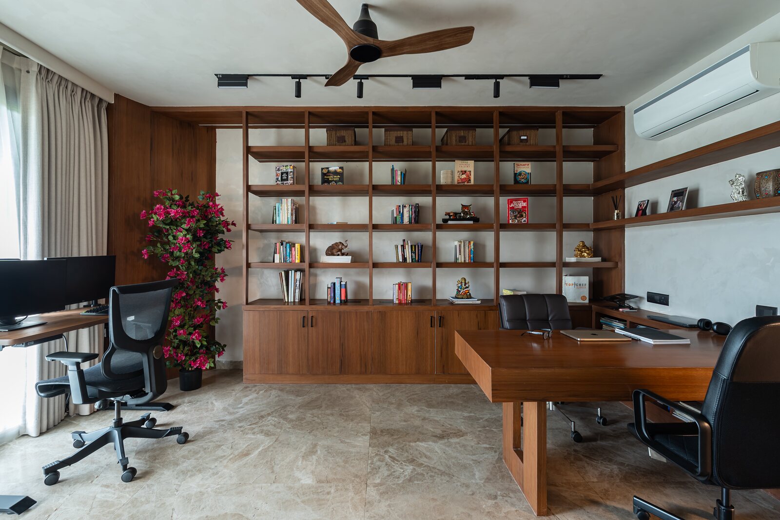 The desk within the lit shelving.