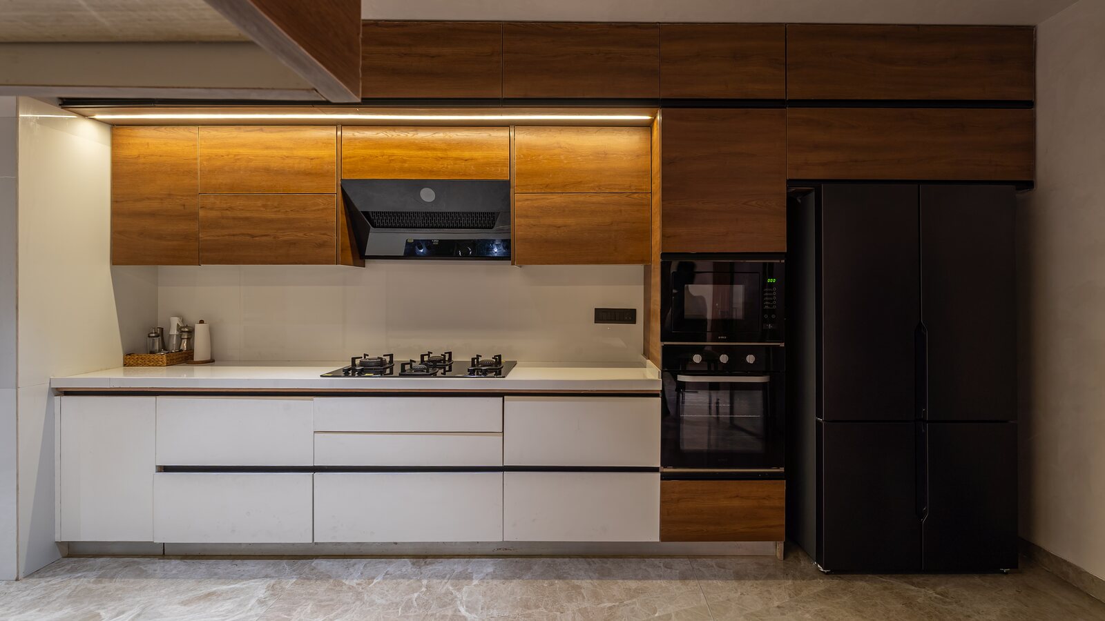 Walnut uppers over white counters.