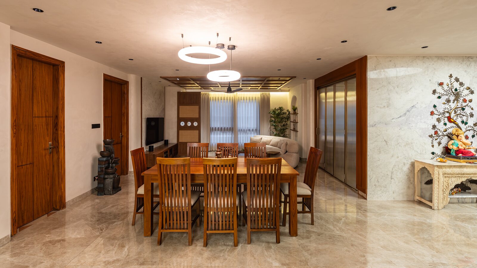 The dining table under a ring of light.
