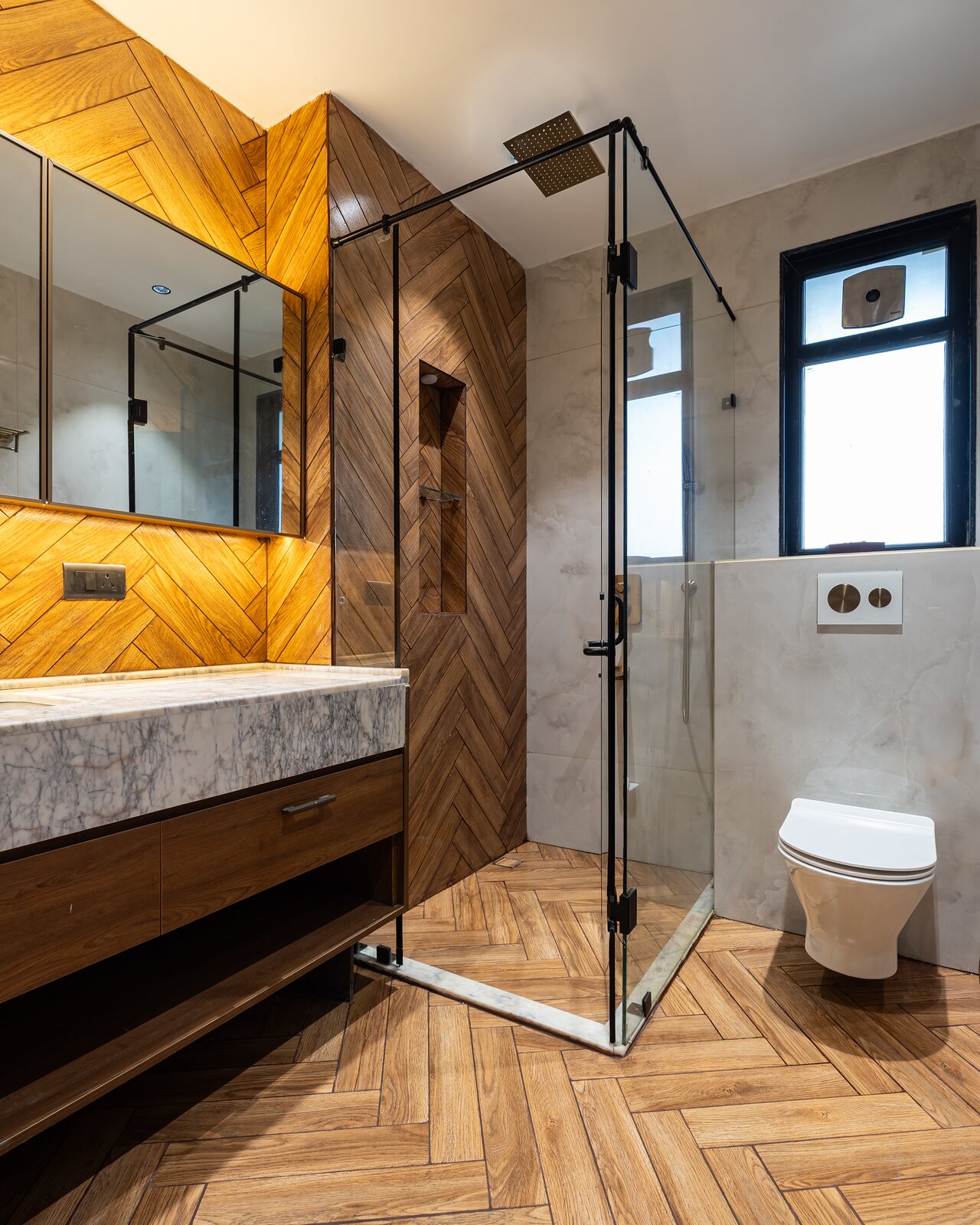 Chevron timber and a glass shower.