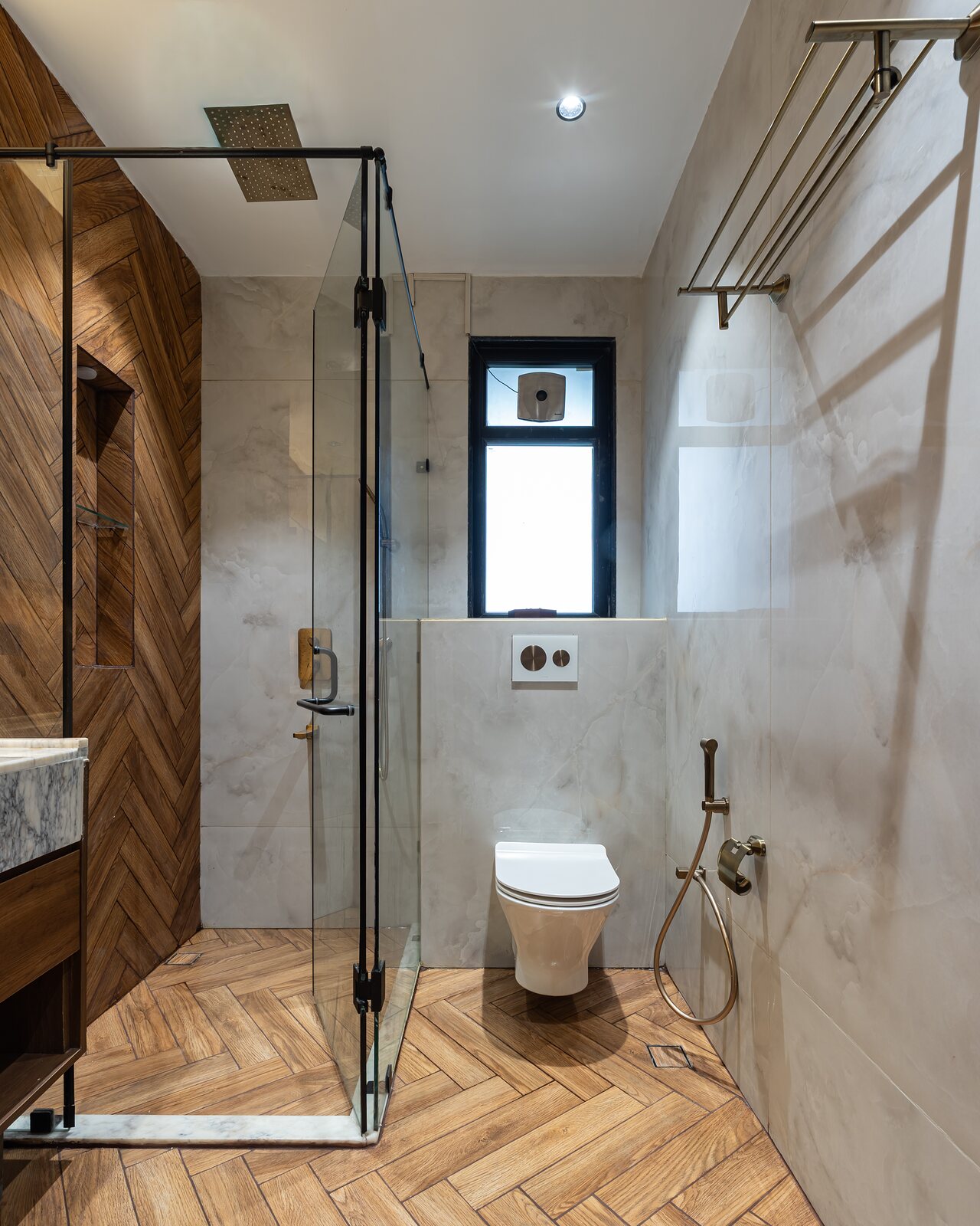 The shower in chevron wood and stone.