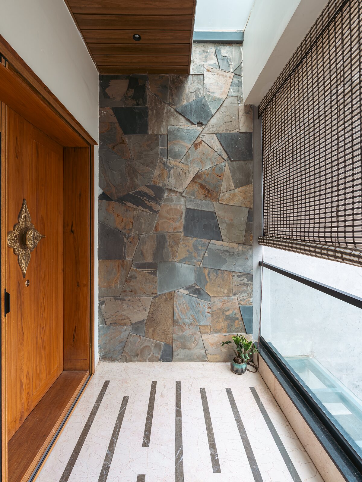 The entry passage, a glass strip set into the stone floor.