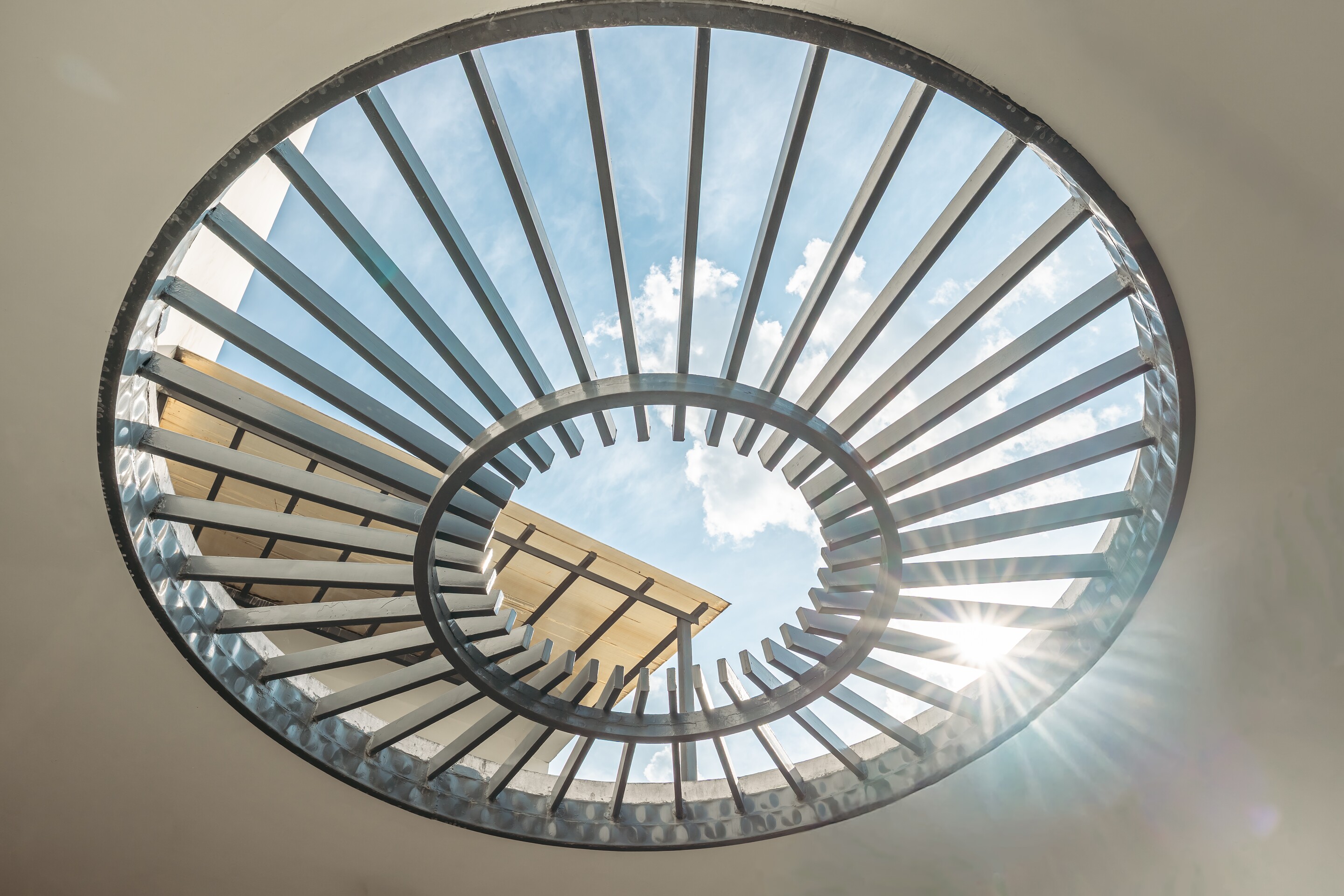 The oculus. A ring of timber slats open to the sky.