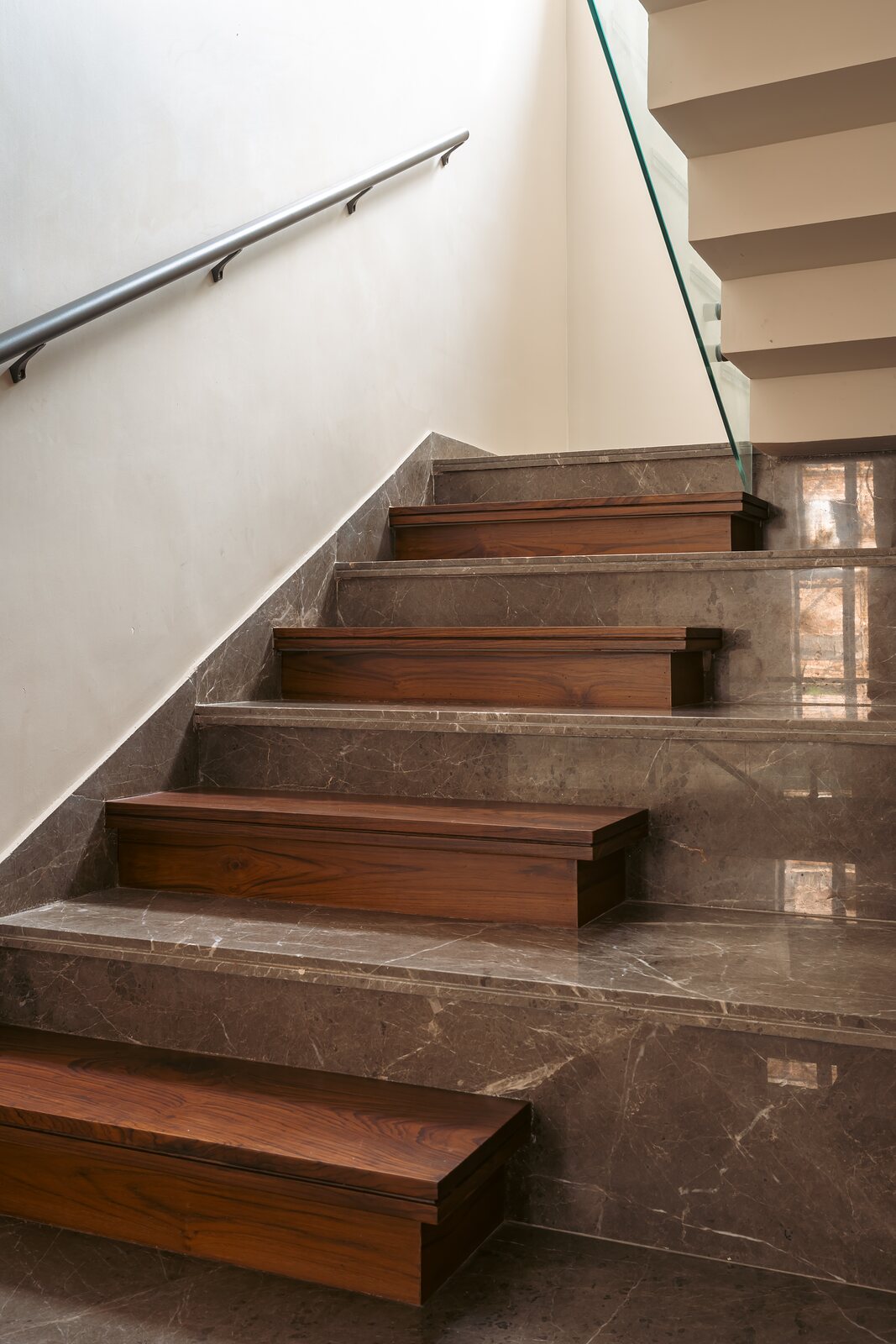 Timber treads cantilever from the stone flight.