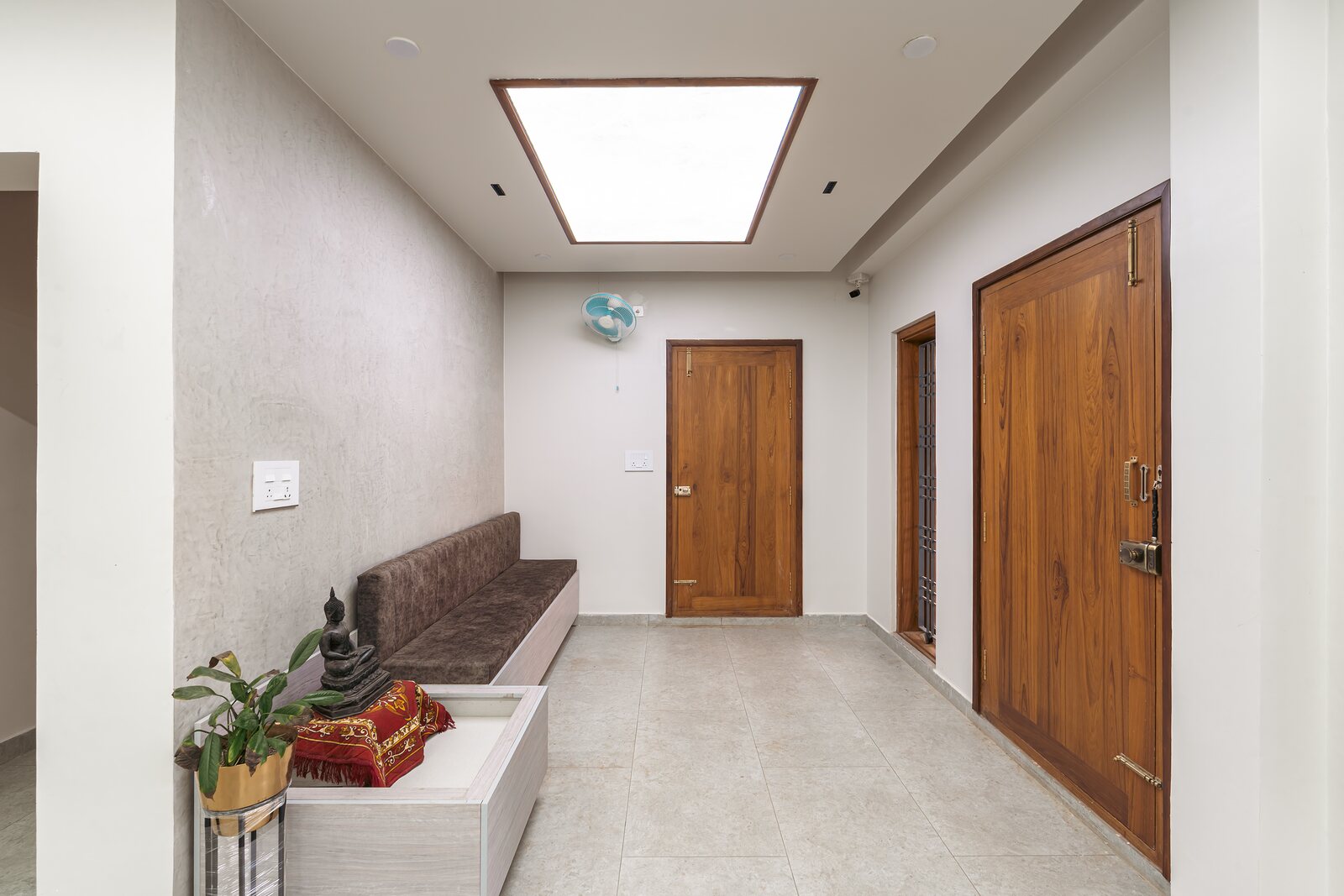 A bedroom, quiet with a teak door.