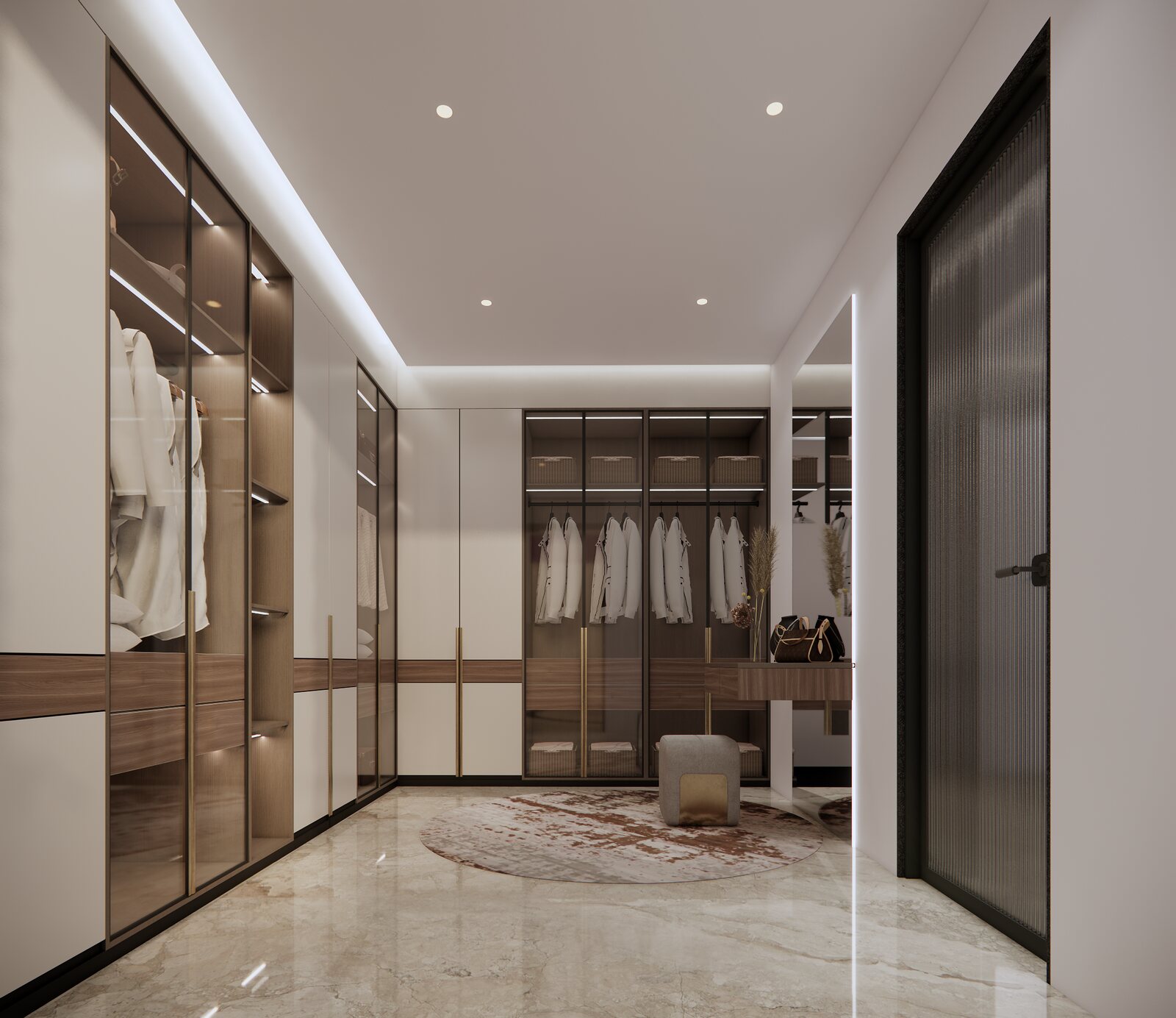 The walk-in wardrobe in glass and brass.