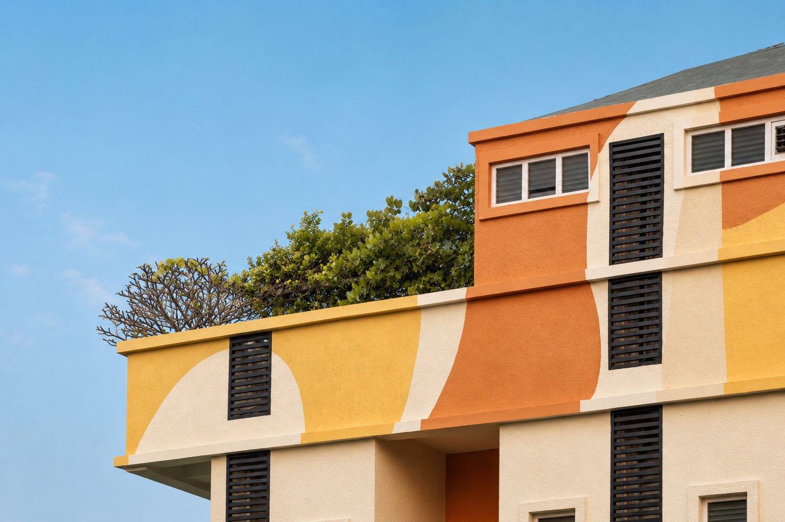 Curved colour forms along the roof parapet.