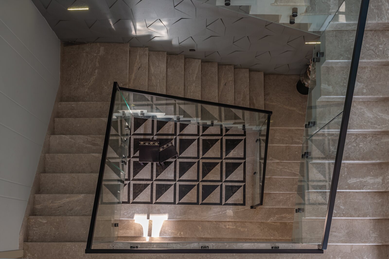 A coffered glass panel lights the landing.