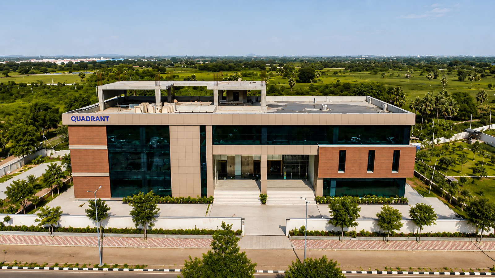 The site from above, the building set behind its forecourt.