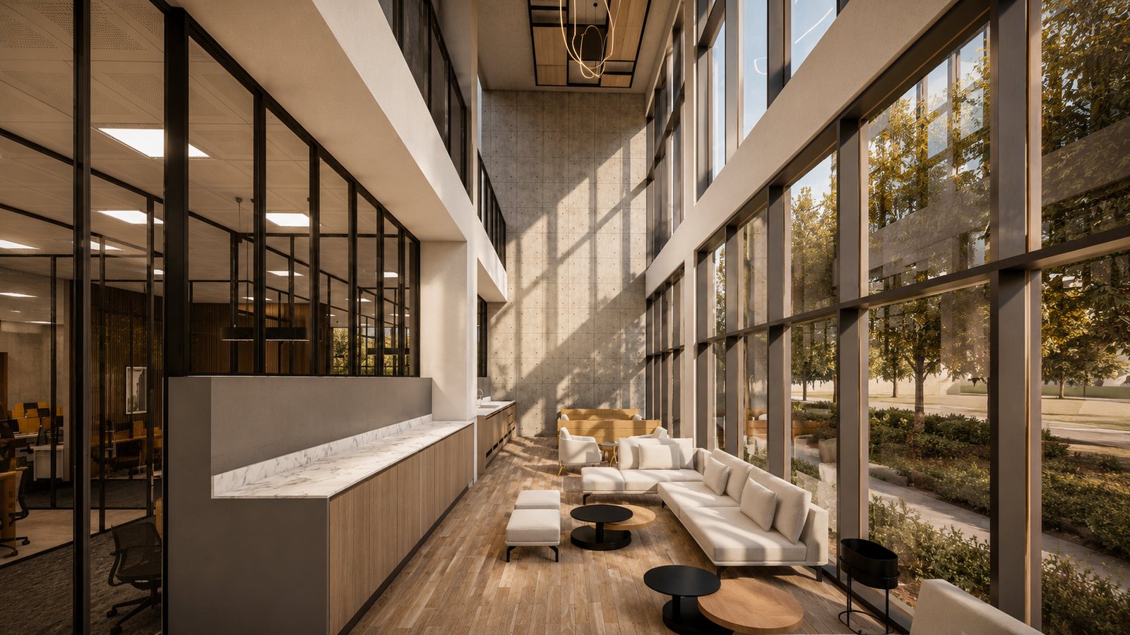 A breakout lounge along the glazed edge, seating in the light.