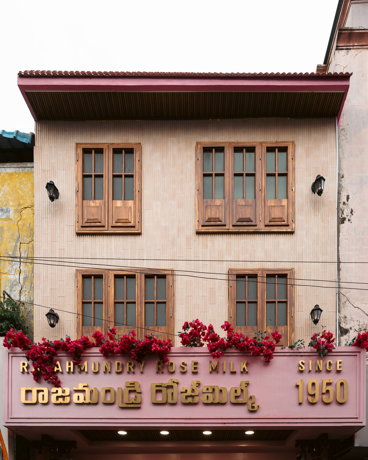 The restored facade, teak windows close.