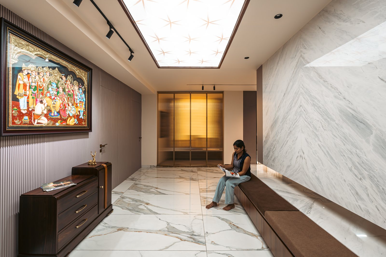 Onyx House, a marble hall with a Tanjore painting.