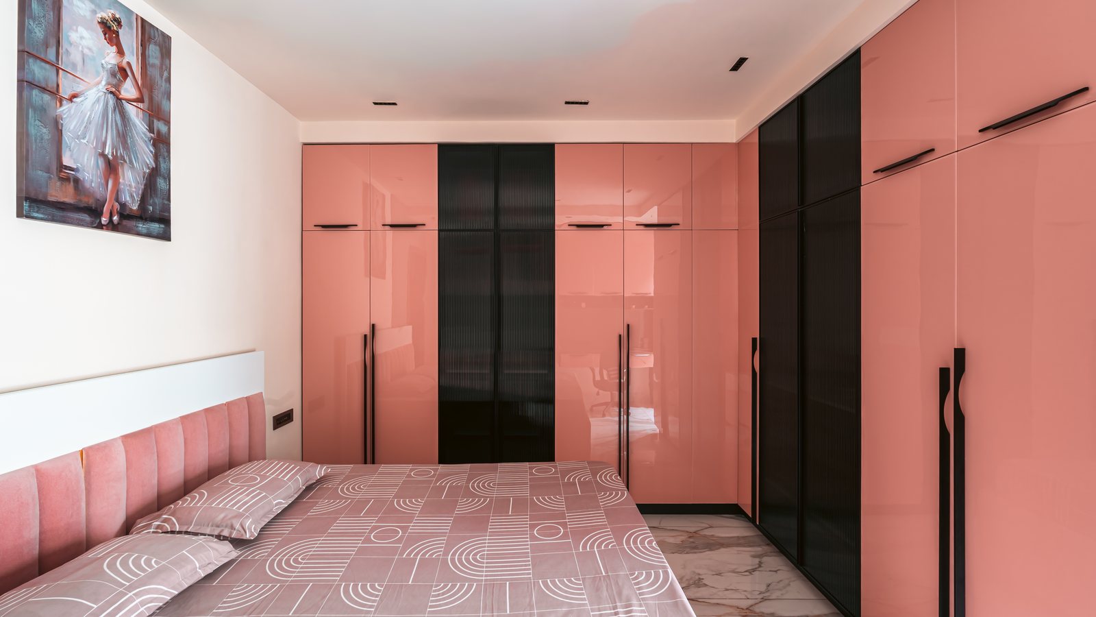 Rose-gloss wardrobes line the room.