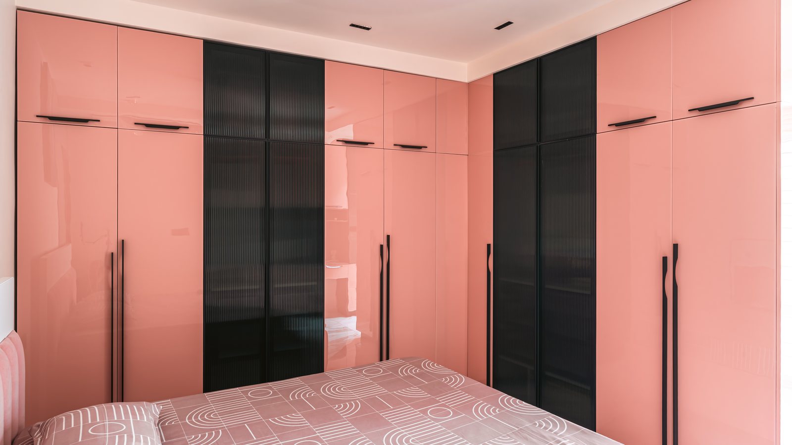 Wardrobes in rose and graphite.