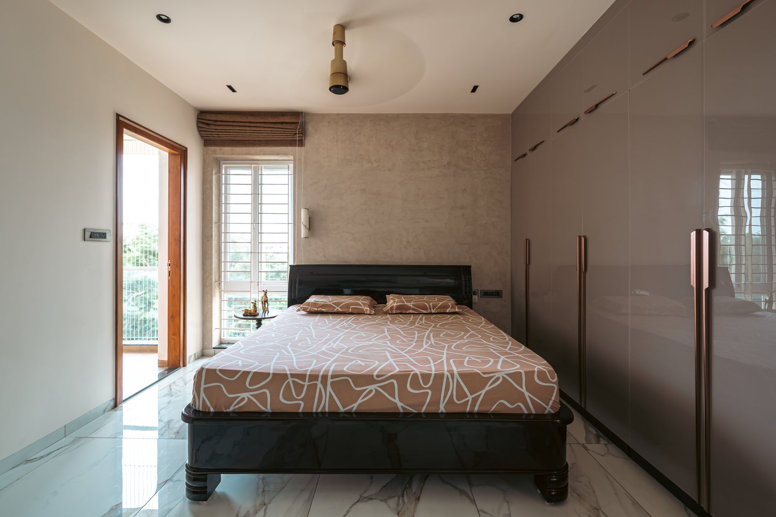 A bedroom open to the morning light.