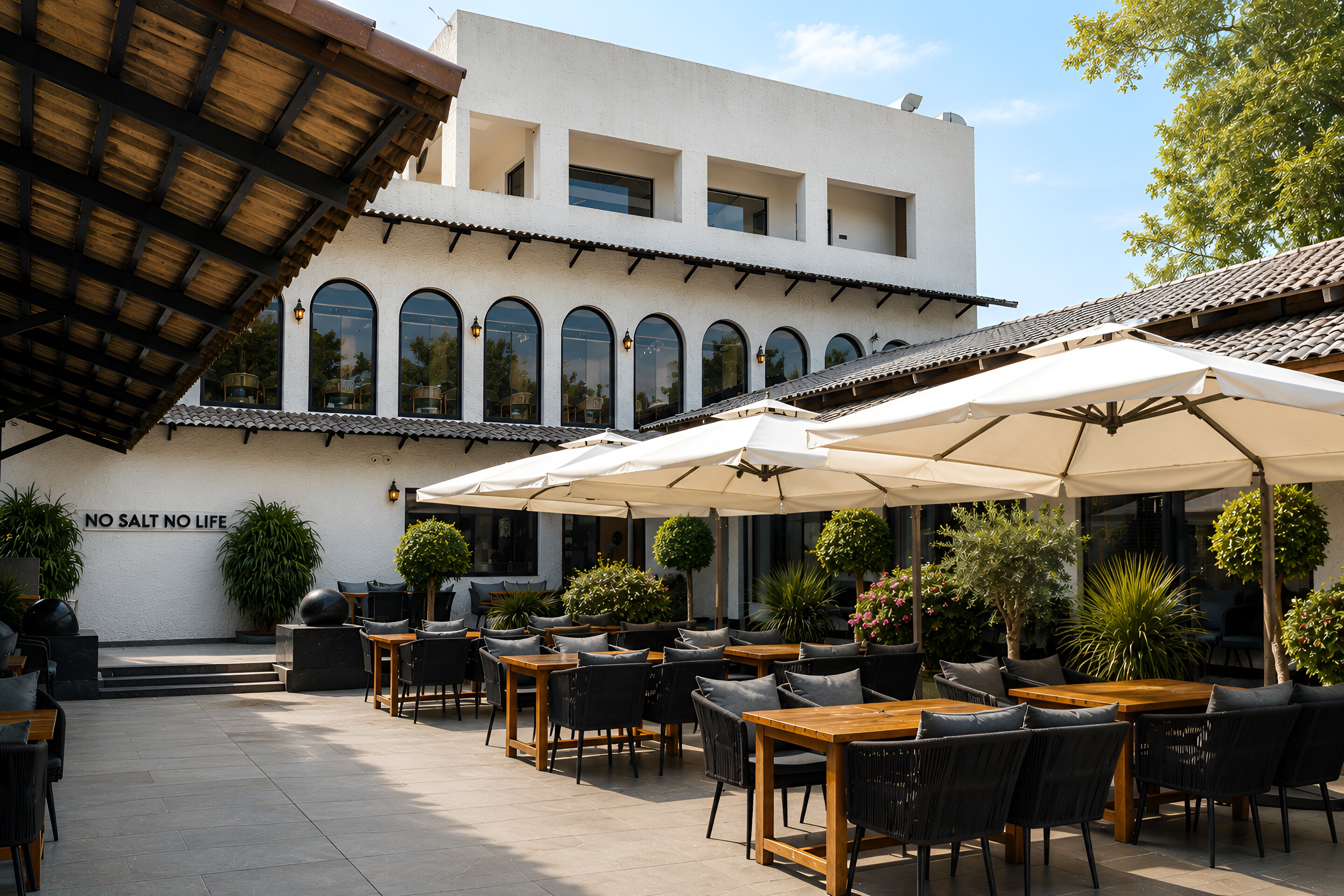 SALT, the courtyard terrace under white umbrellas.