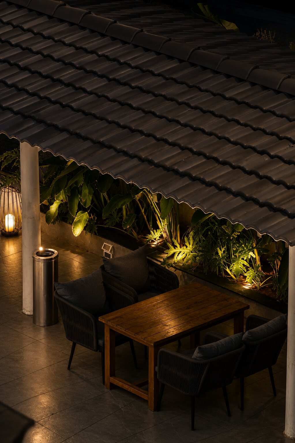 Lanterns and planting along the tiled edge.