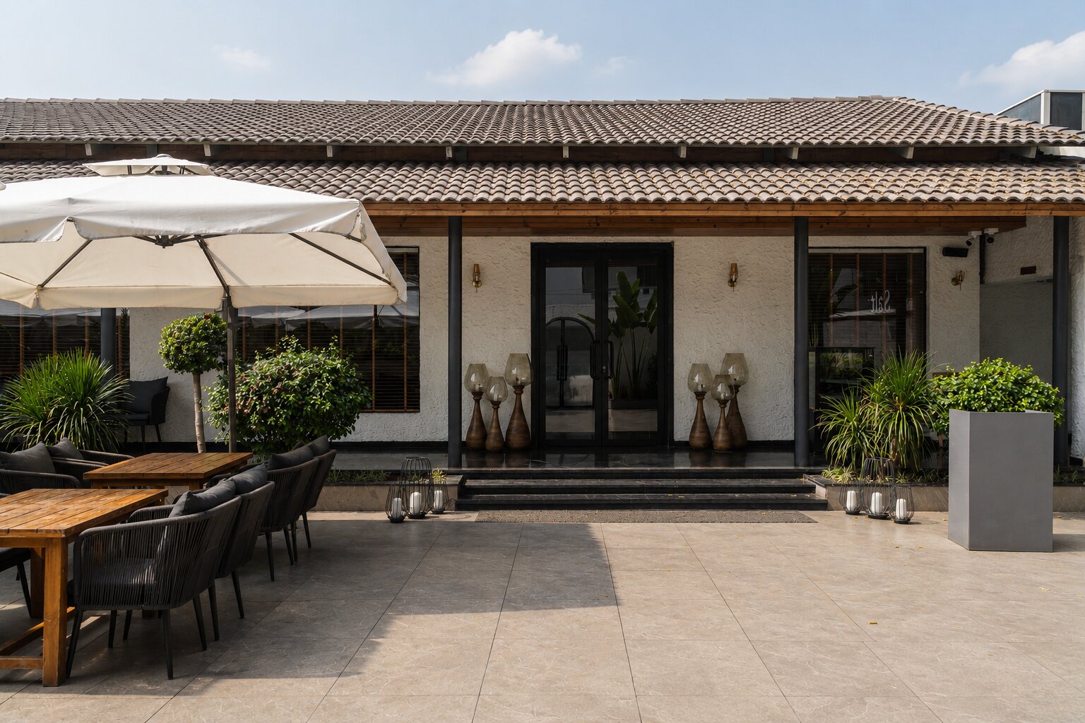 Outdoor dining under a canvas umbrella.