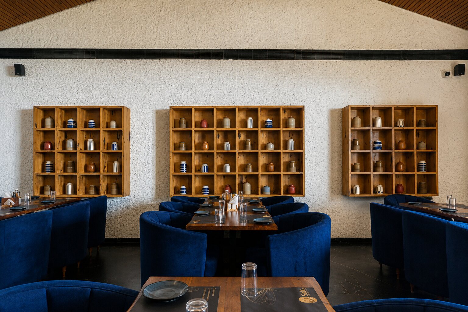 Dining beside the spice-jar shelving.