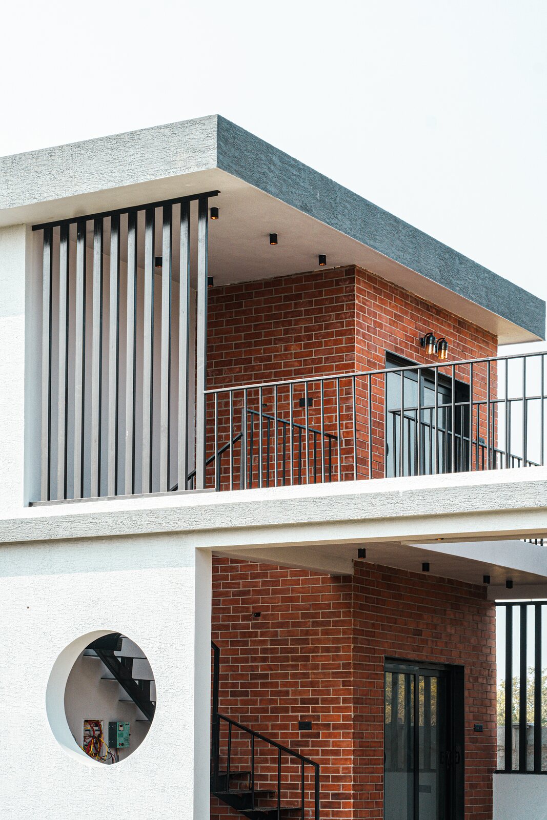 The circle frames the stair and the balcony beyond.