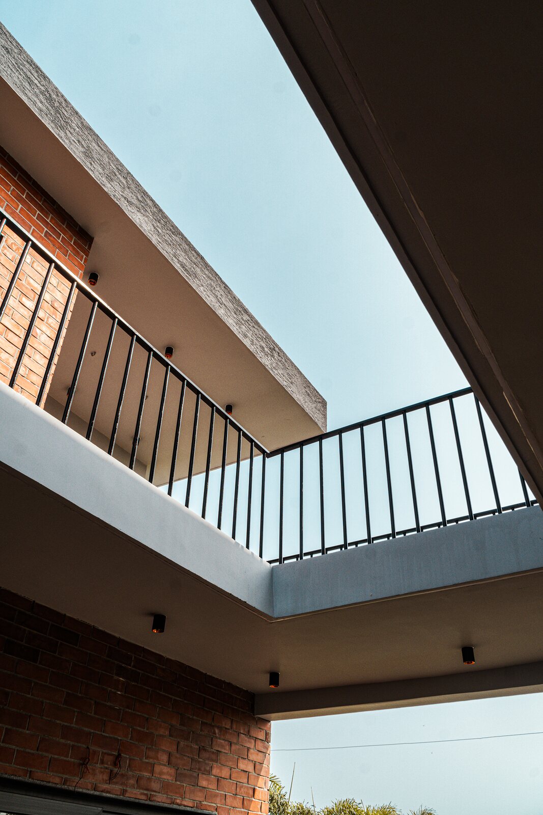The underside of the cantilever against the sky.