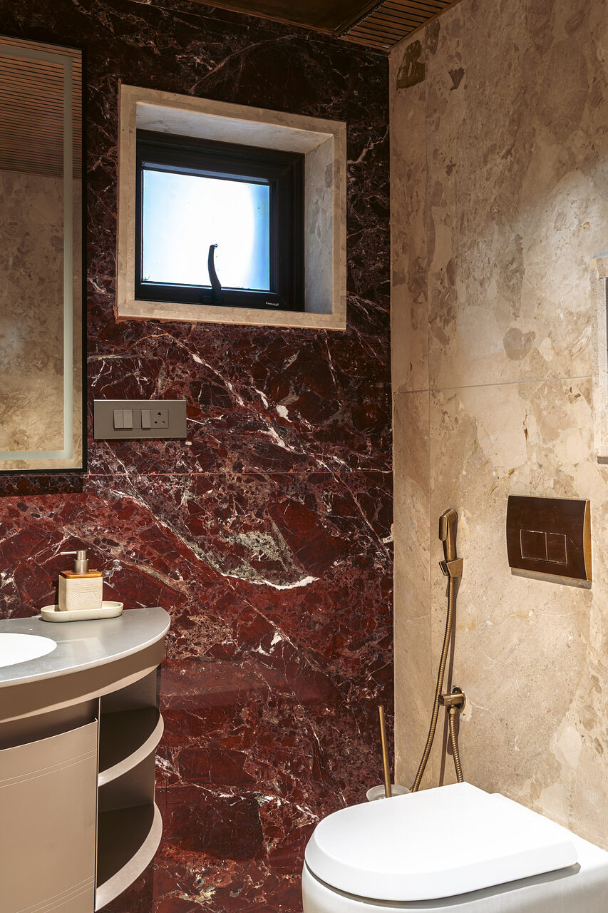 The powder room in oxblood marble.