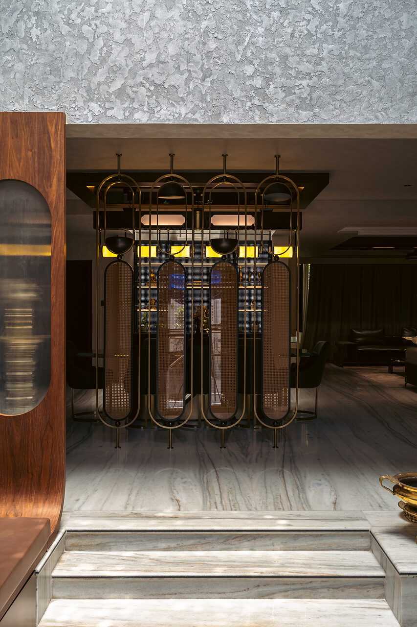 Brass and timber screen doors at the entry.