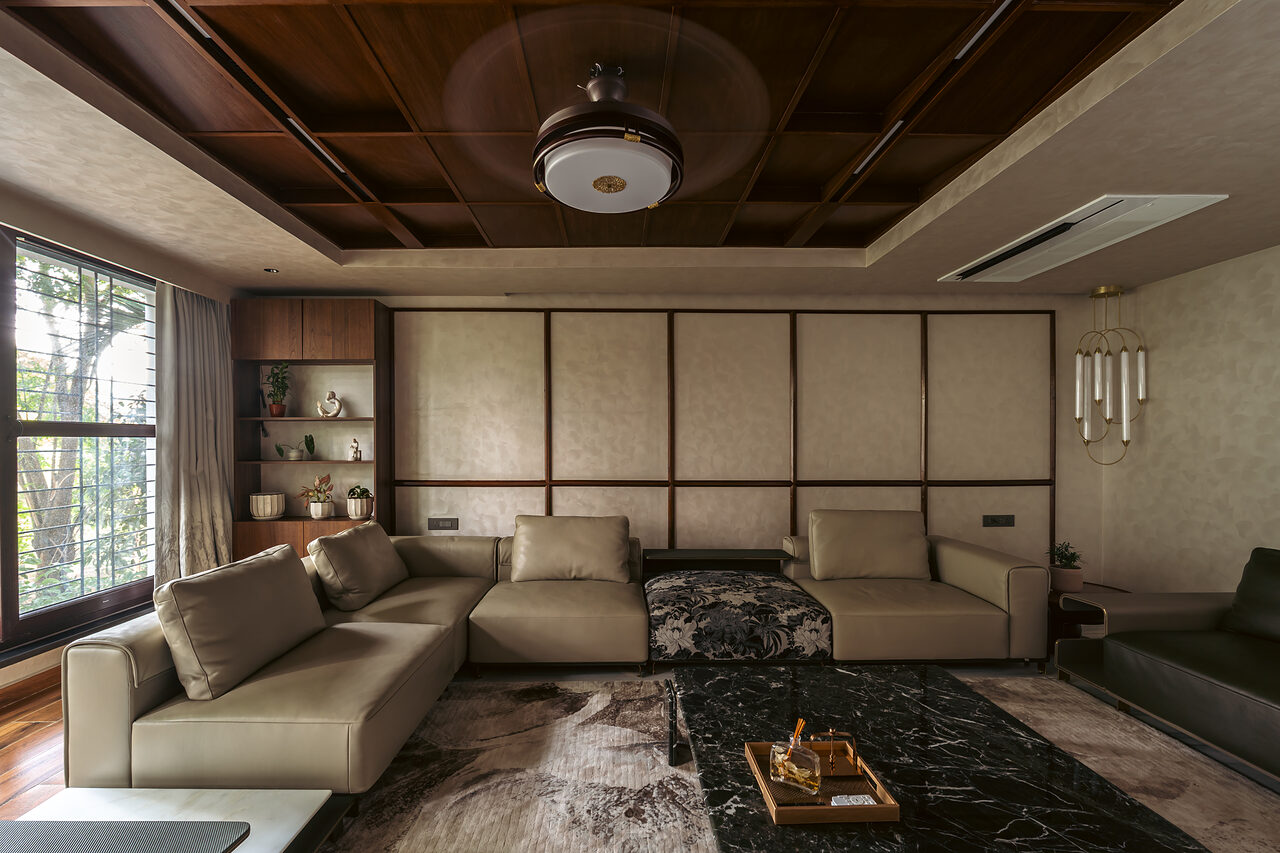 The family media room under a coffered timber ceiling.
