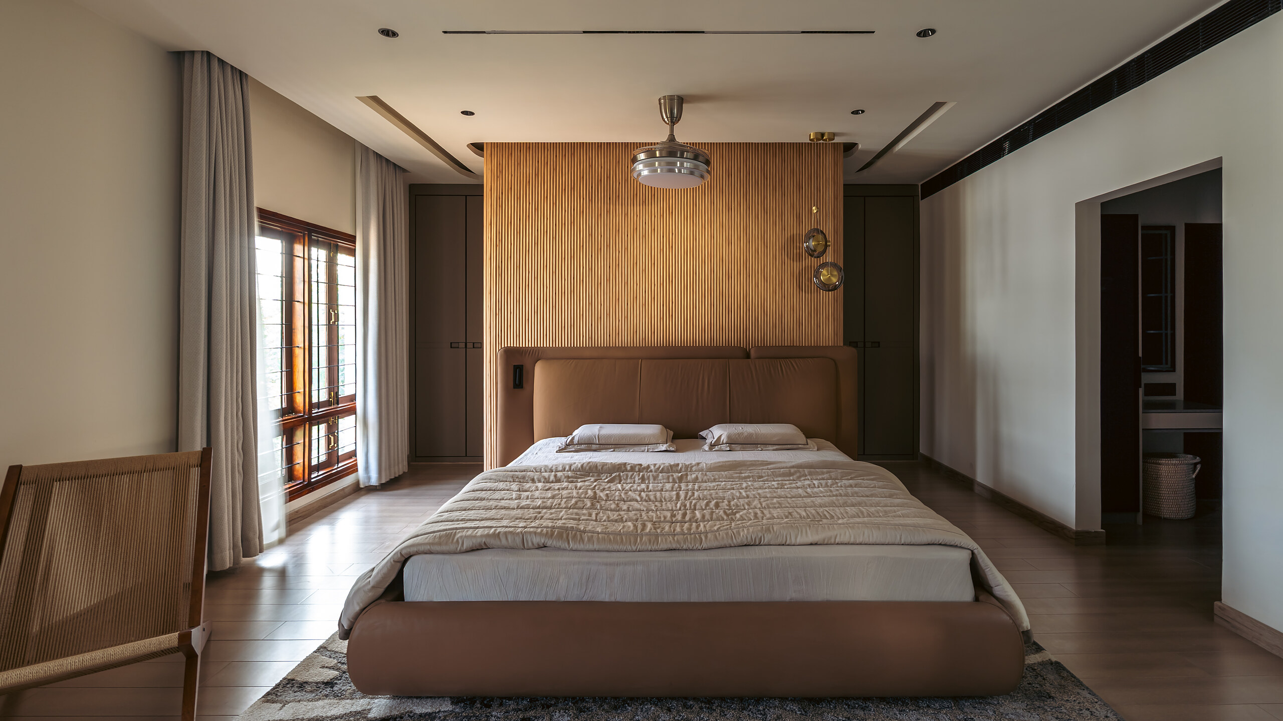 The master bedroom, panelled in wood.